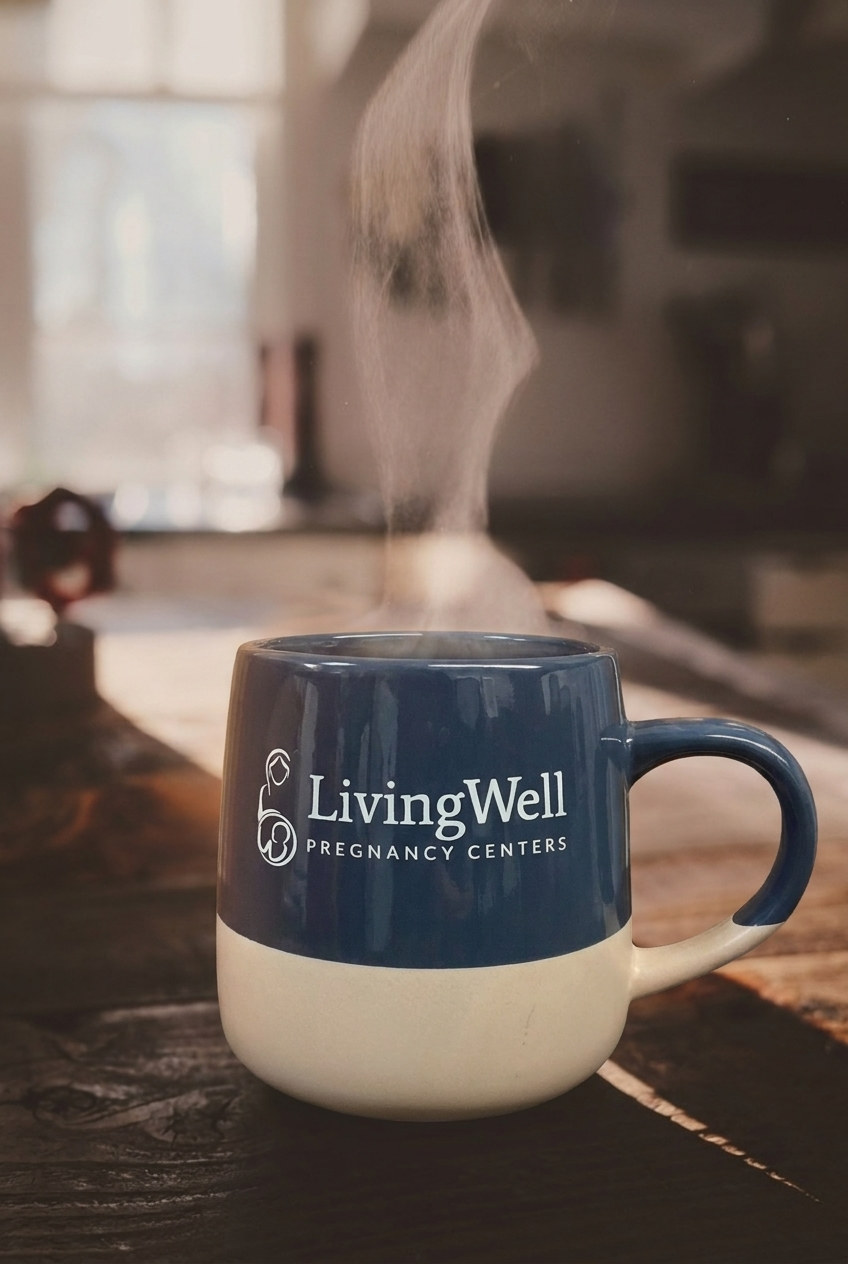 A steaming LivingWell mug of coffee in warm morning light
